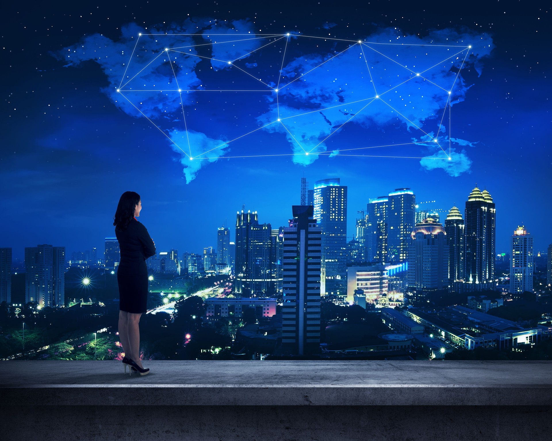 Asian business person standing on the rooftop