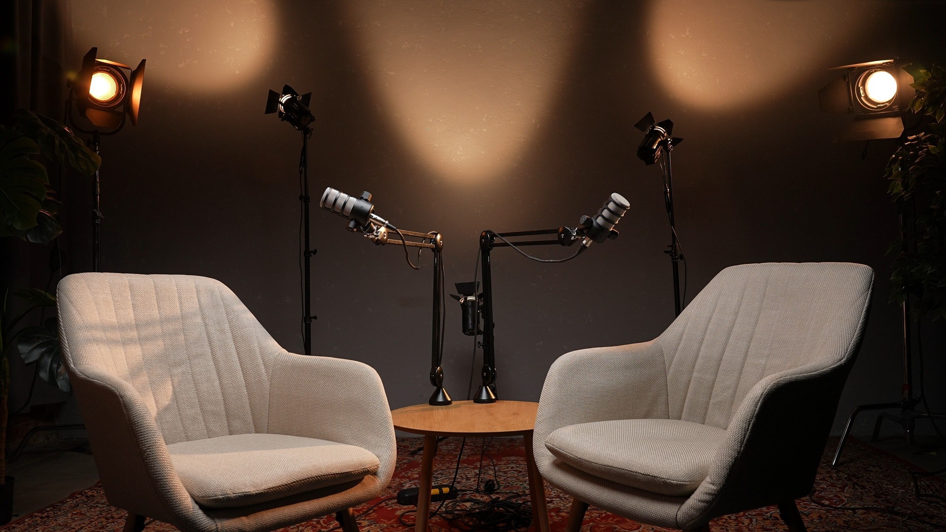 Creative Storytelling Unfolds in a Cozy Podcast Studio With Warm Lighting